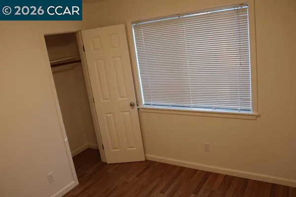 a view of a storage & utility room with a window