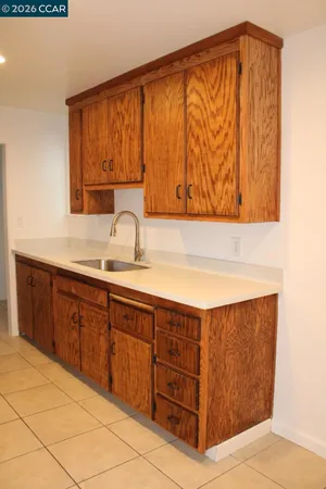 a bathroom with a sink a mirror and vanity