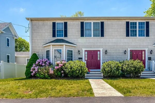 a front view of a house with yard