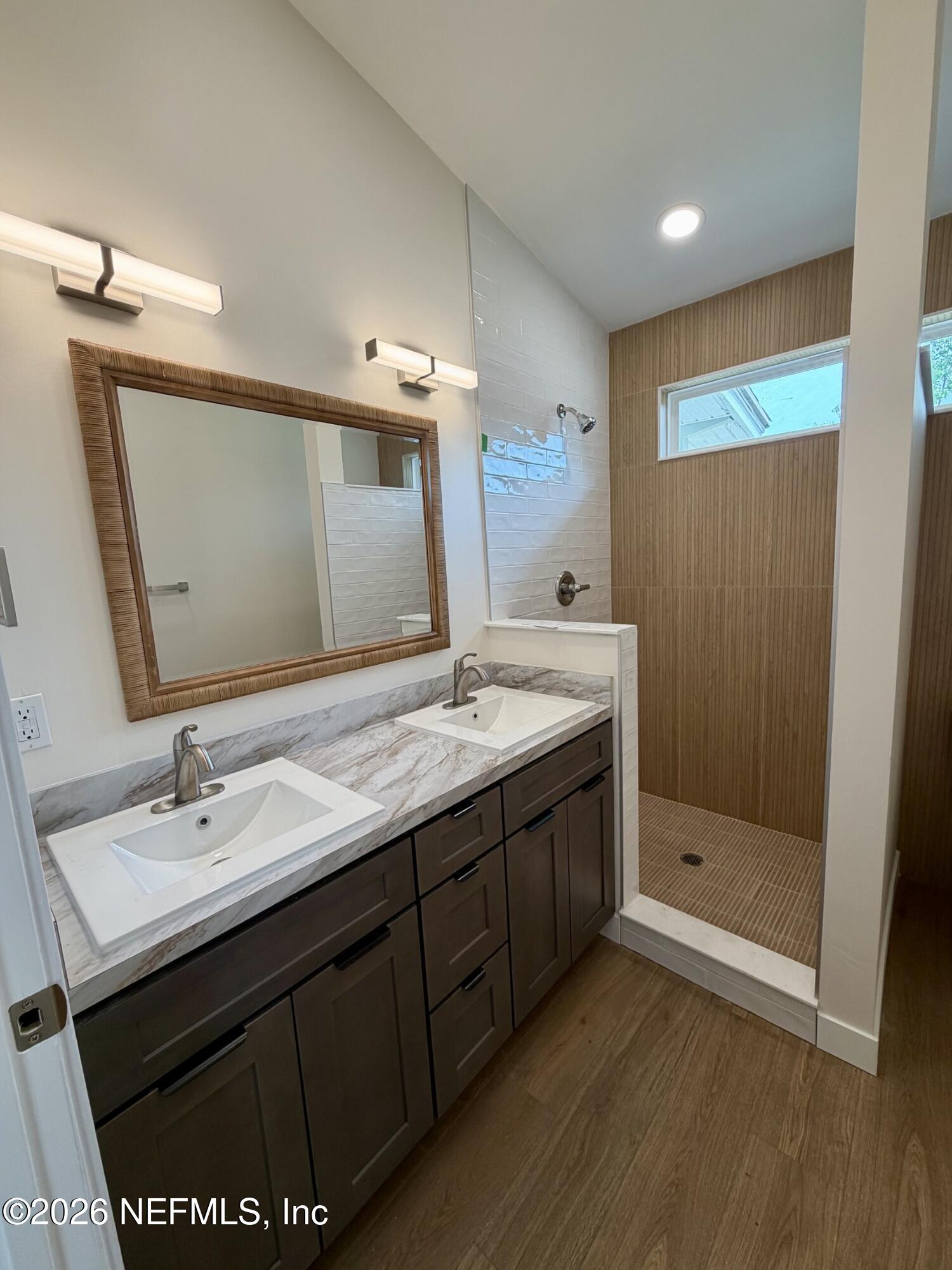 223 North Collen Road Jacksonville, FL 32218 - Photo 10 of 11 a bathroom with a sink and a mirror
