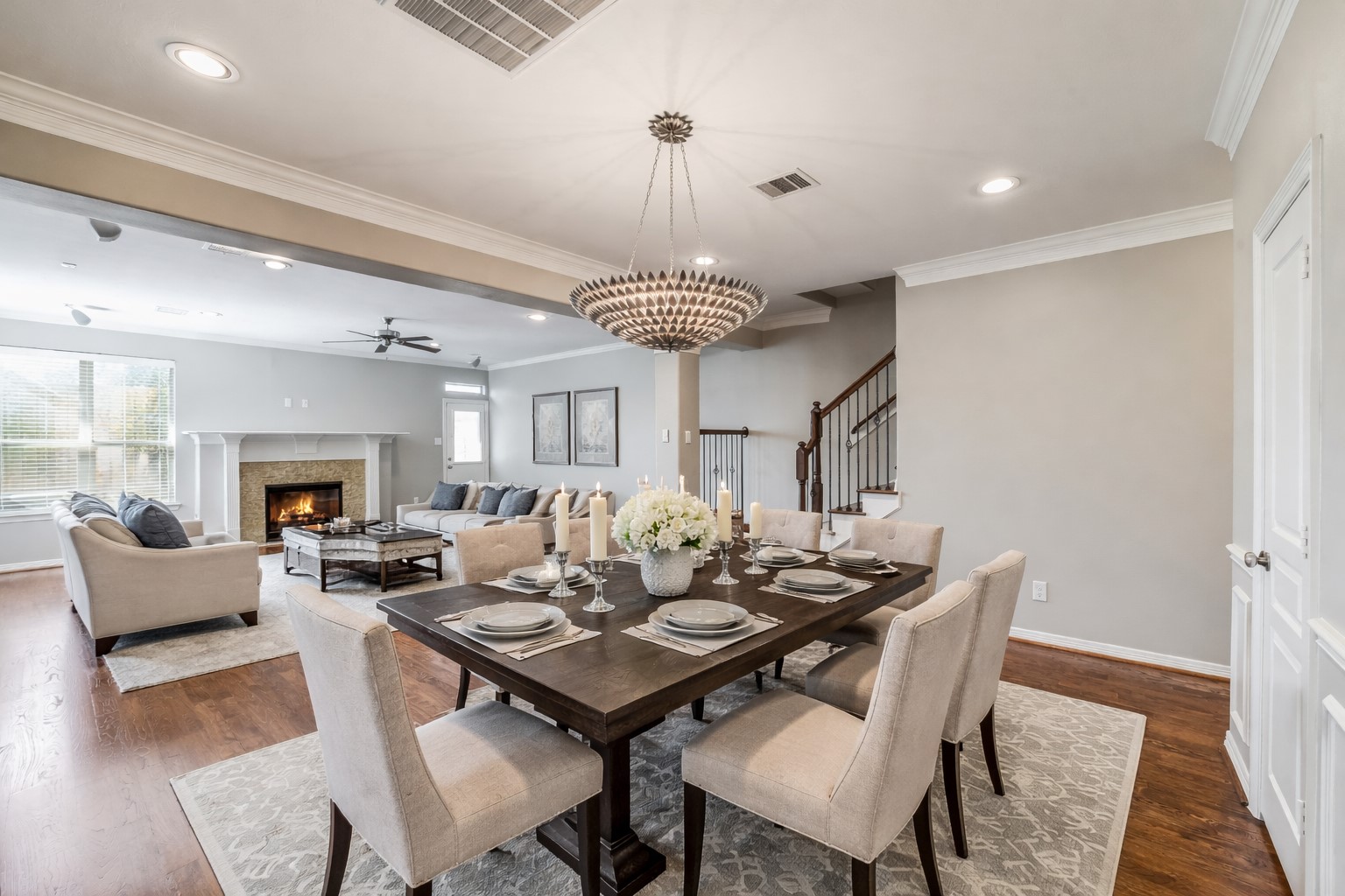1303 Dorothy Street Houston, TX 77008 - Photo 21 of 21 Open floor plan for formal dining room and living room. Hardwoods, crown molding and recessed hardwood lighting throughout the first floor. Formal dining has decorative light fixture. Note this photo has been virtually staged.