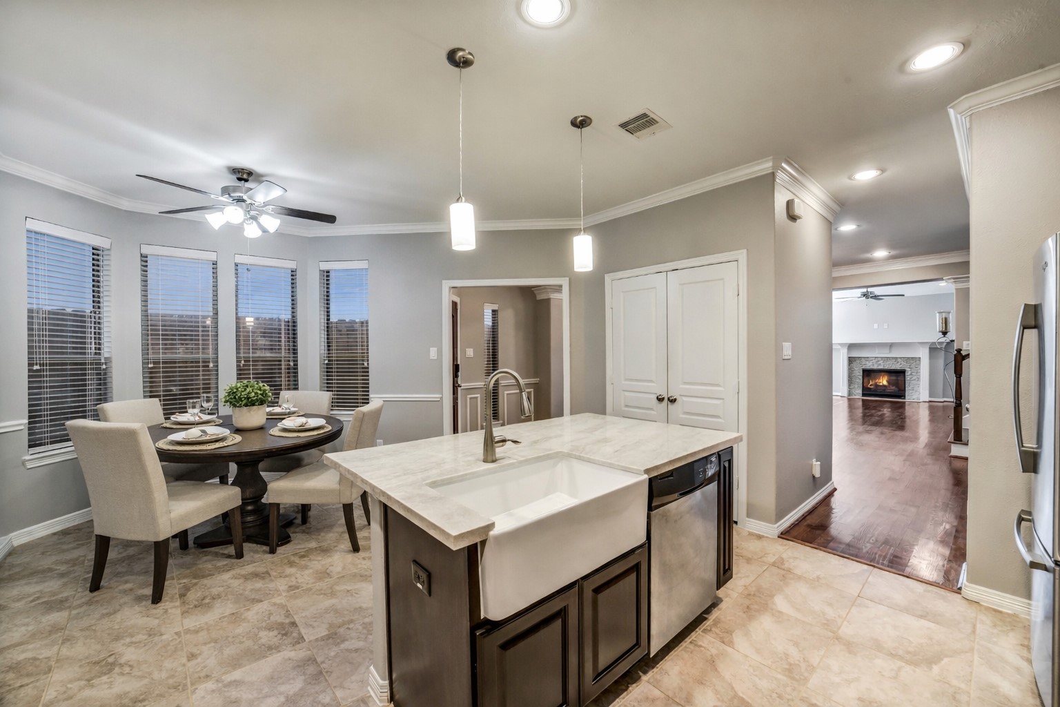1303 Dorothy Street Houston, TX 77008 - Photo 6 of 21 Alternate view showing the eat in kitchen with large breakfast space. The large apron front kitchen sink in the island with breakfast bar seating. Note this photo has been virtually staged.