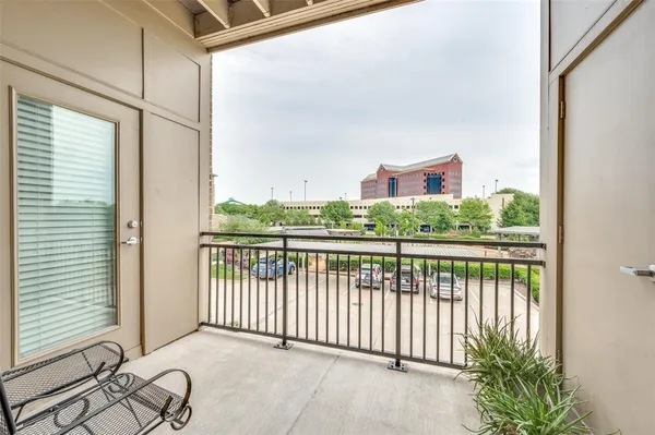 a view of a balcony with furniture