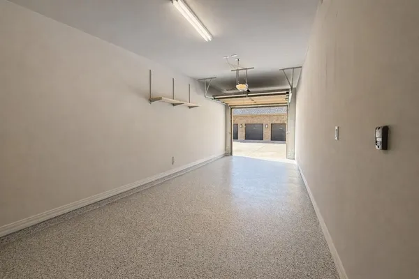 a view of a kitchen with a sink and a window