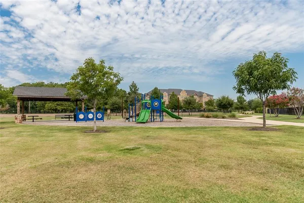 a view of a swimming pool and trees in the background