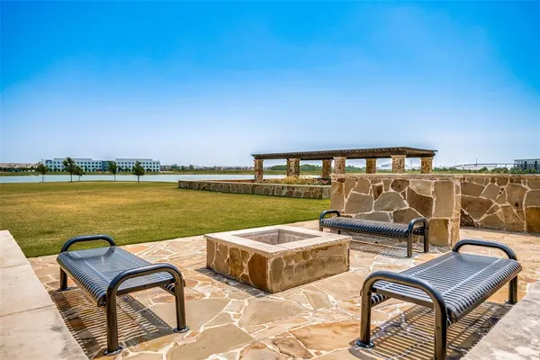 a view of a ocean with outdoor seating