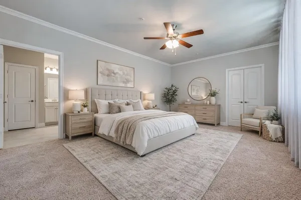 a spacious bedroom with a bed and ceiling fan