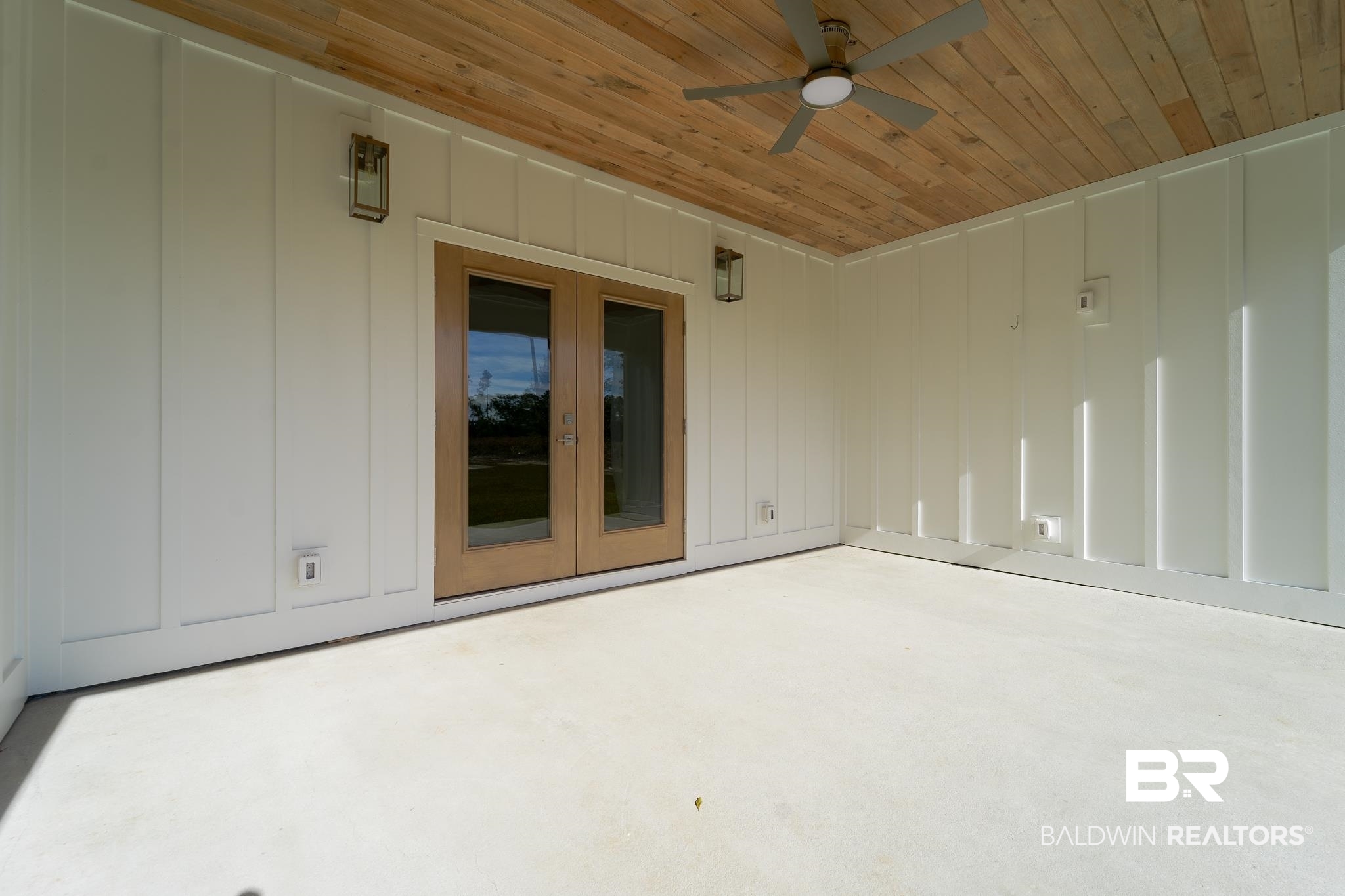9263 Clarke Ridge Road Foley, AL 36535 - Photo 31 of 40 Empty room featuring ceiling fan, french doors, and wood ceiling