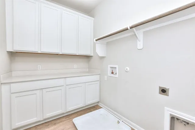 a bathroom with a sink and cabinets