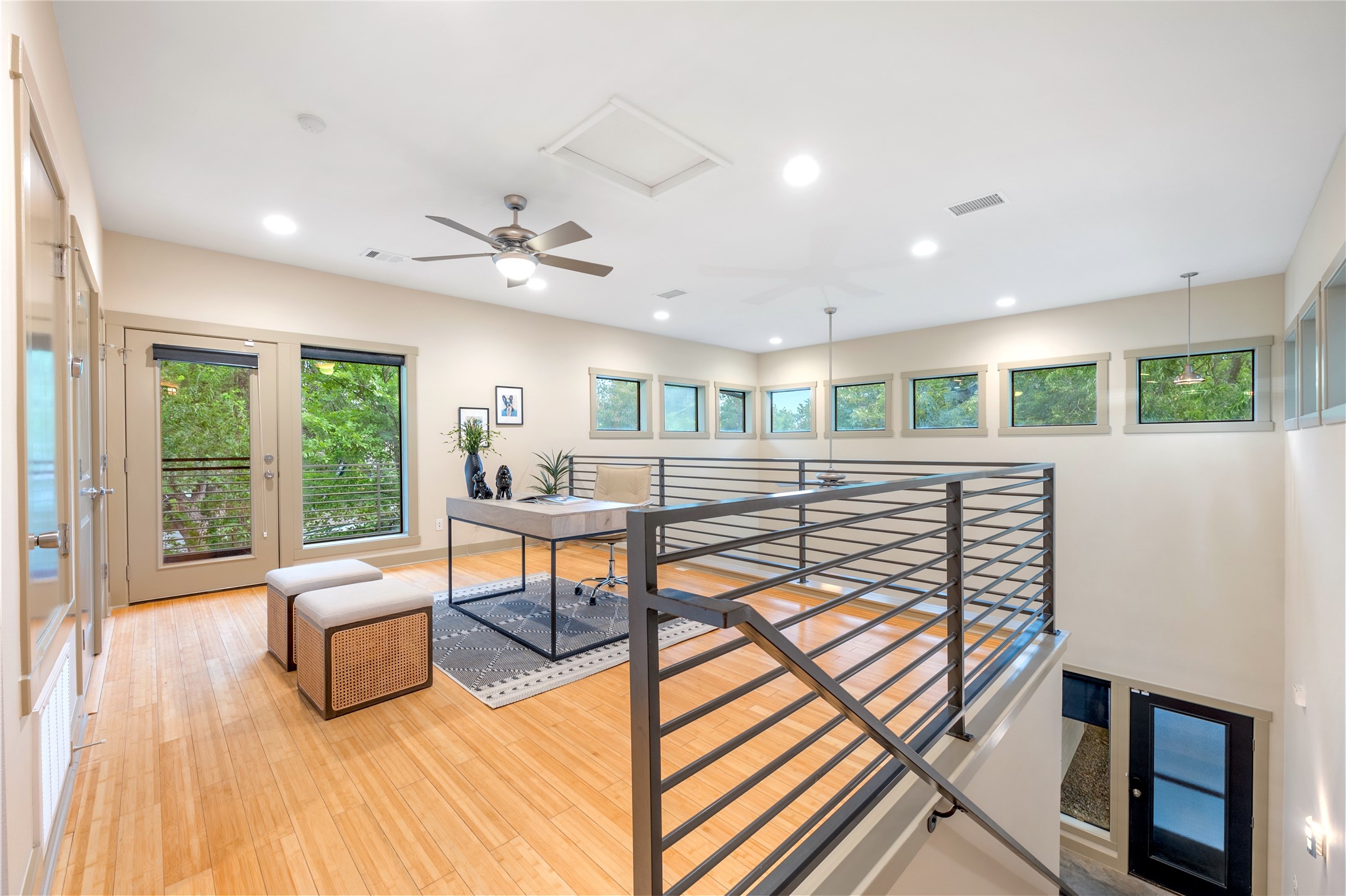 2512 East 2nd Street Austin, TX 78702 - Photo 5 of 40 Head upstairs and you’ll find a spacious loft that overlooks the downstairs living area.