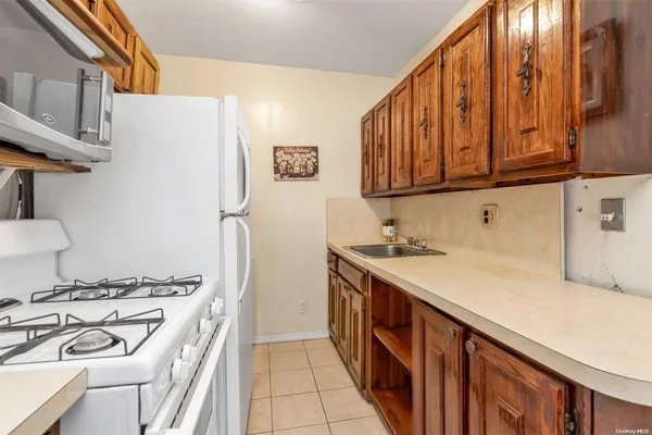 a kitchen with stainless steel appliances granite countertop a stove and a refrigerator