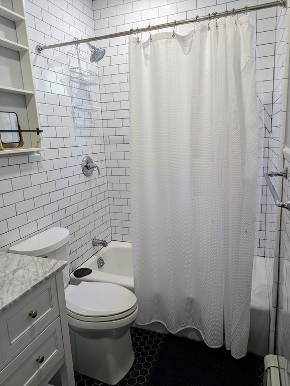 60 Day Street, Unit 1 Boston, MA 02130 - Photo 7 of 10 a bathroom with a toilet and shower