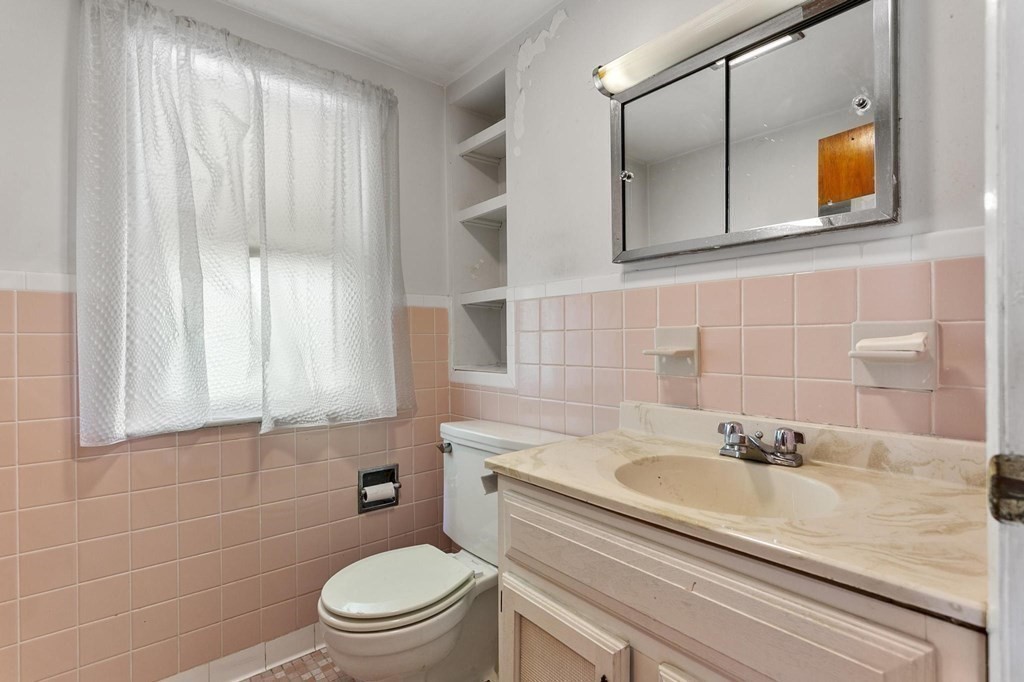 26 Shawsheen Road Bedford, MA 01730 - Photo 11 of 18 a bathroom with a sink a toilet and shower