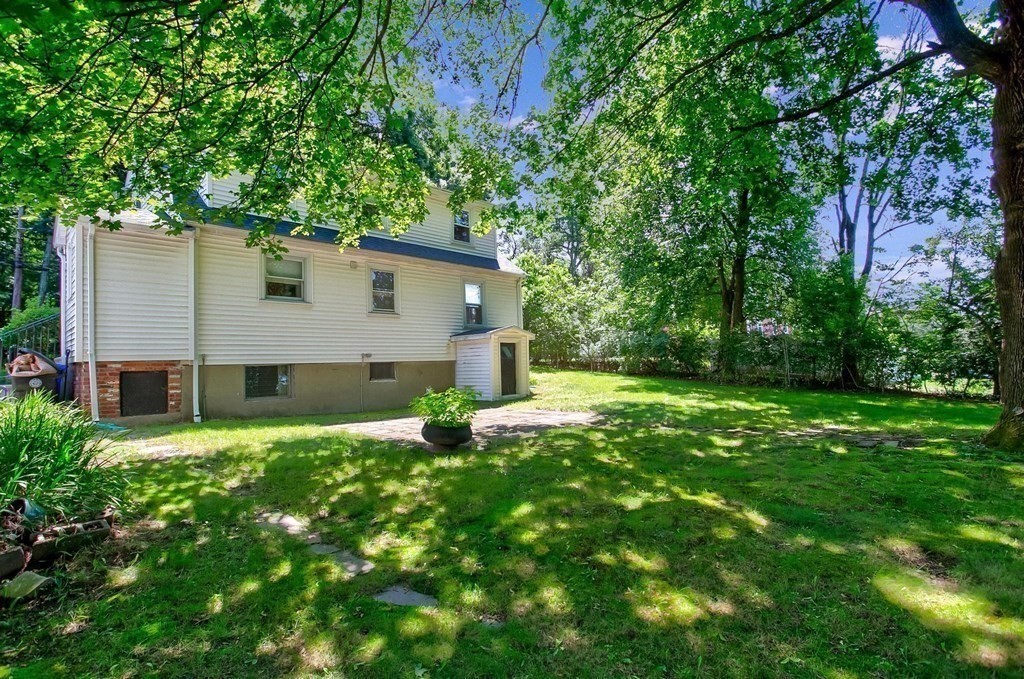 26 Shawsheen Road Bedford, MA 01730 - Photo 15 of 18 a house that is sitting in the grass