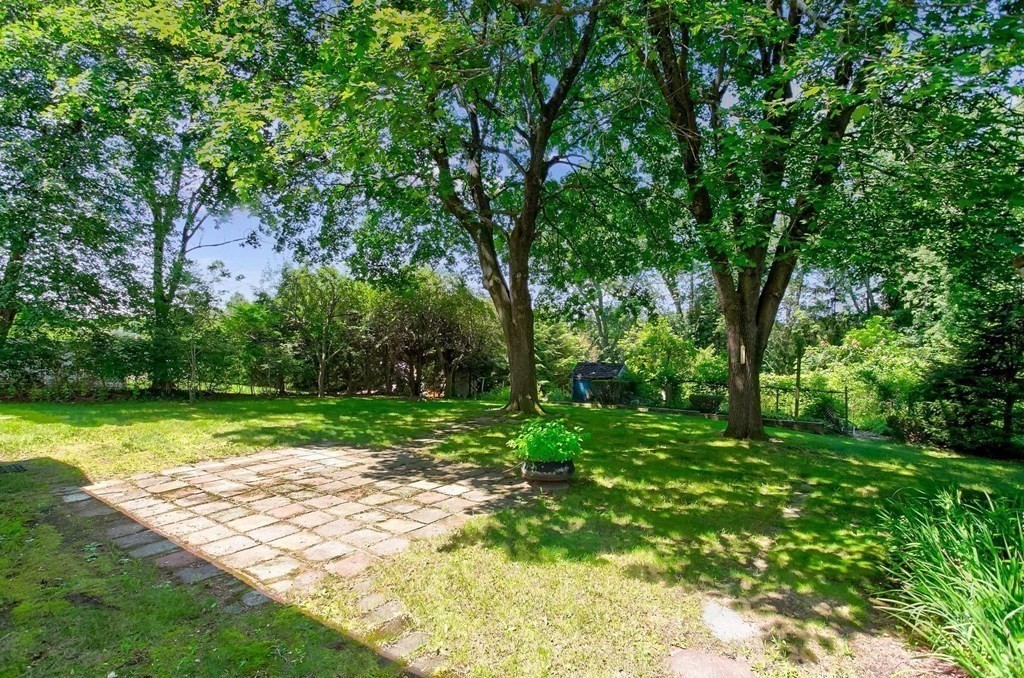 26 Shawsheen Road Bedford, MA 01730 - Photo 17 of 18 a view of a backyard with large trees