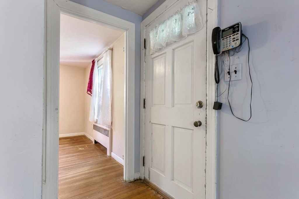 26 Shawsheen Road Bedford, MA 01730 - Photo 3 of 18 a view of a bathroom from a hallway