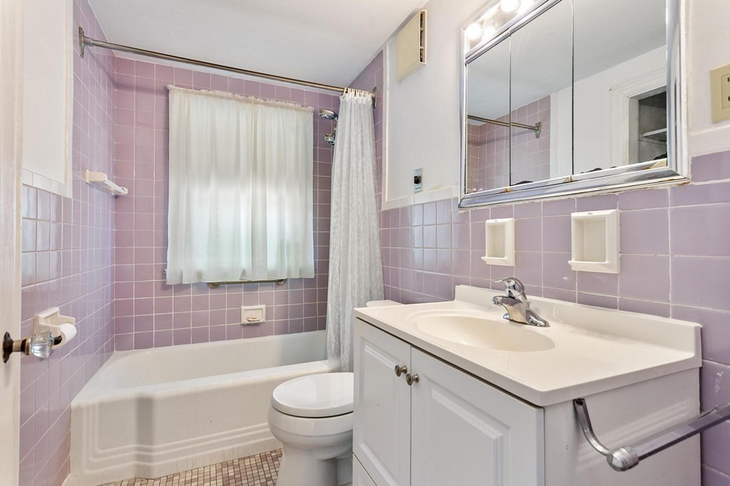 26 Shawsheen Road Bedford, MA 01730 - Photo 7 of 18 a bathroom with a sink a toilet and bathtub