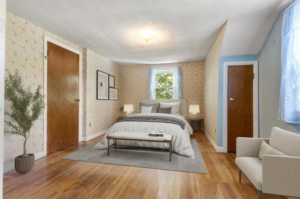 26 Shawsheen Road Bedford, MA 01730 - Photo 10 of 18 a bed room with a bed and a couch