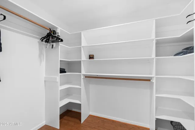 a view of storage and utility room with washer and dryer