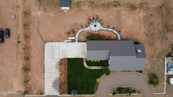 a view of a backyard with sitting area