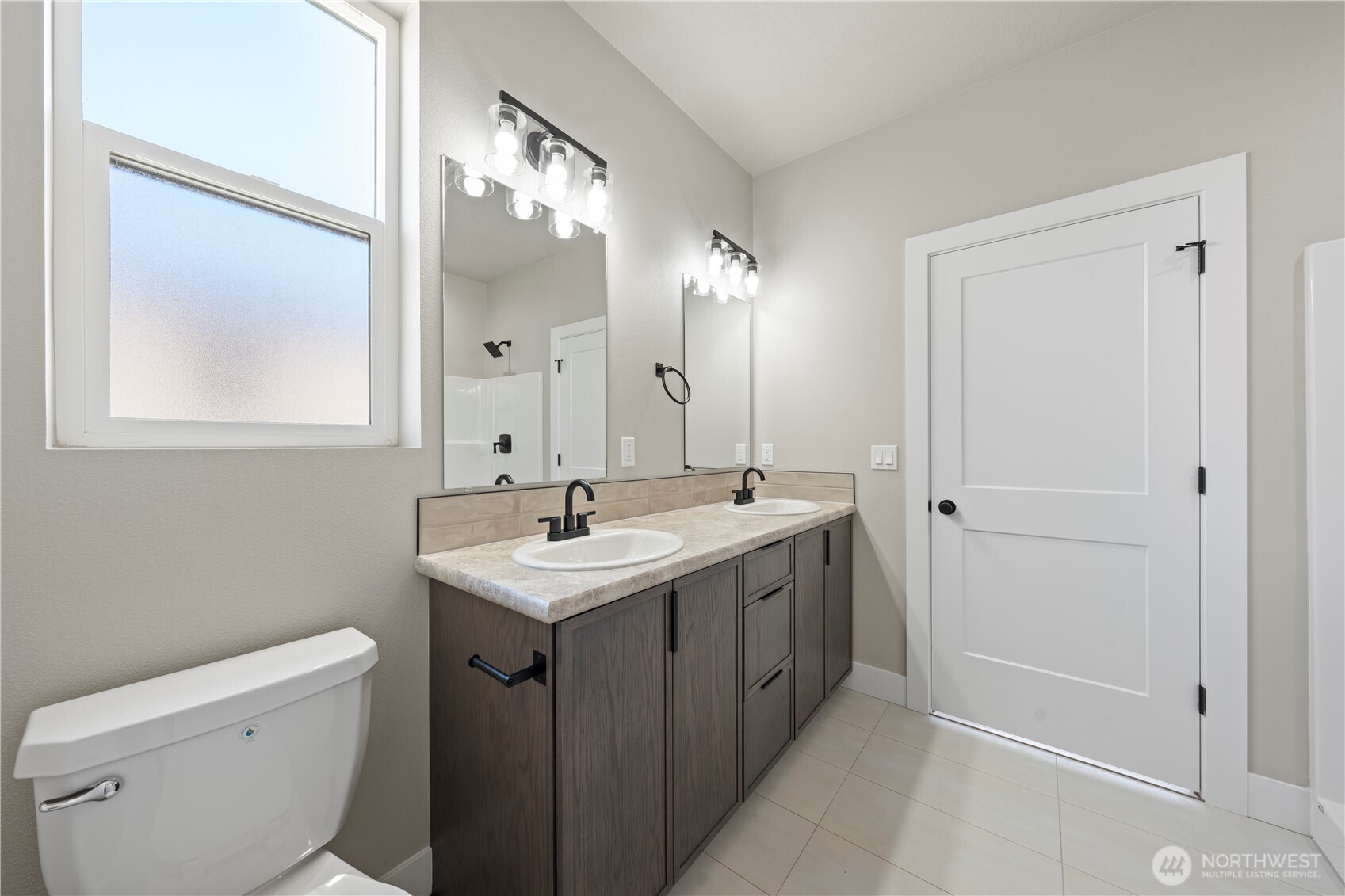 1249 E Mount Othello, WA 99344 - Photo 6 of 33 a bathroom with a toilet sink and mirror