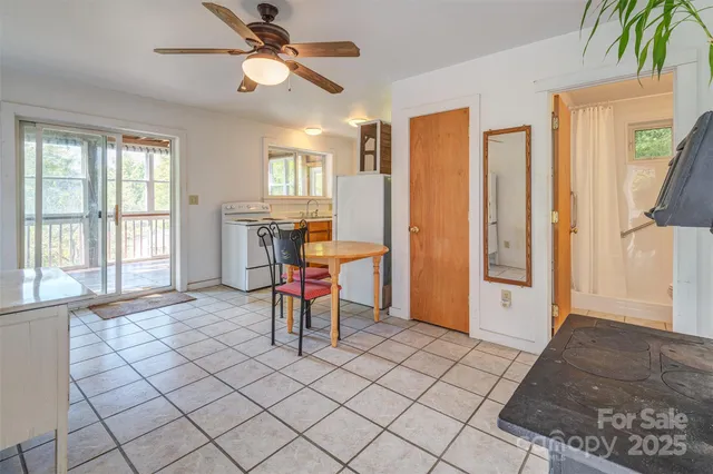 a view of a livingroom with furniture and a window
