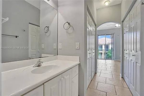 a bathroom with a double vanity sink and mirror