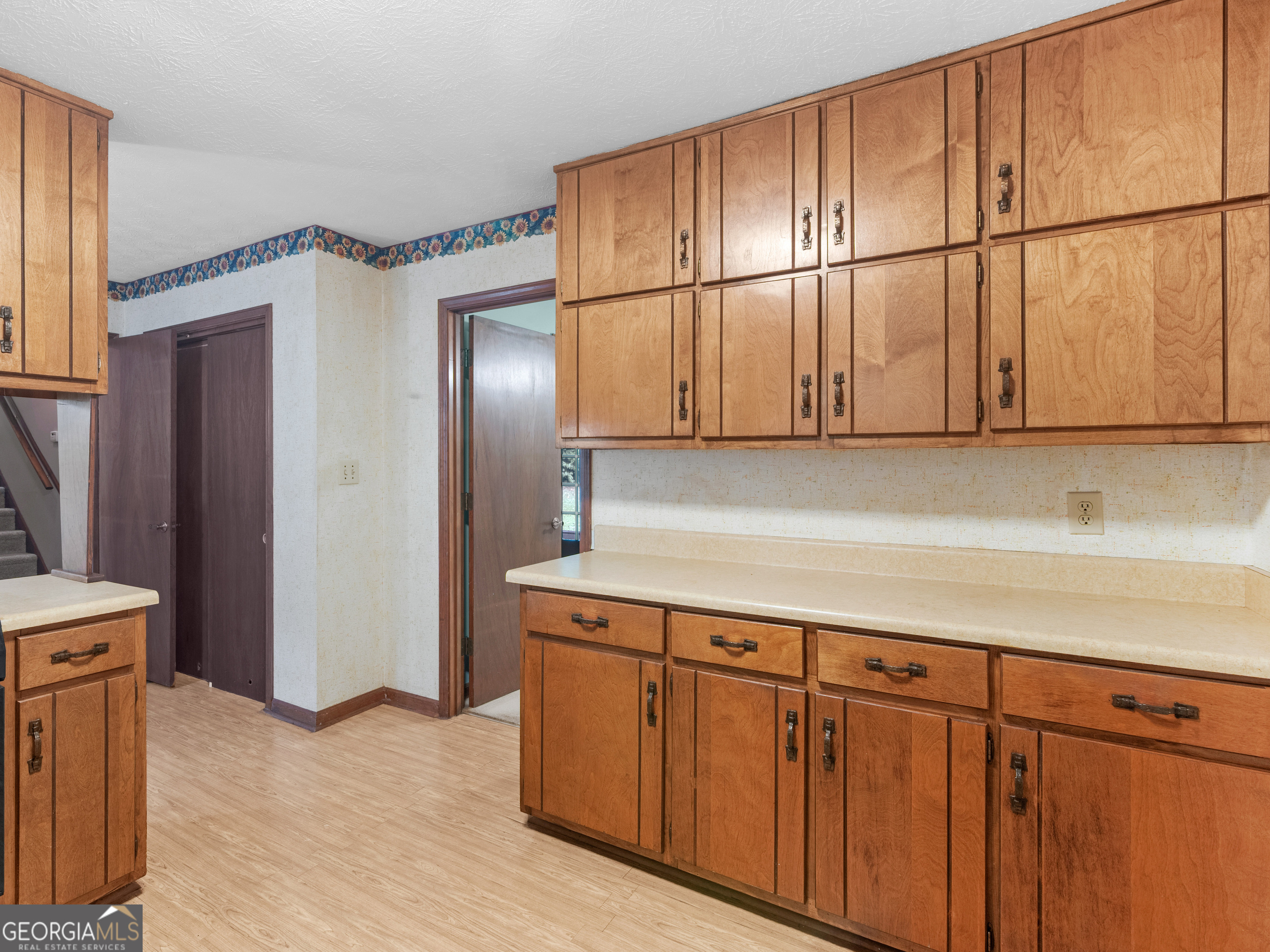 8294 Winston Way Jonesboro, GA 30236 - Photo 13 of 62 a kitchen with stainless steel appliances granite countertop wooden cabinets a sink and dishwasher