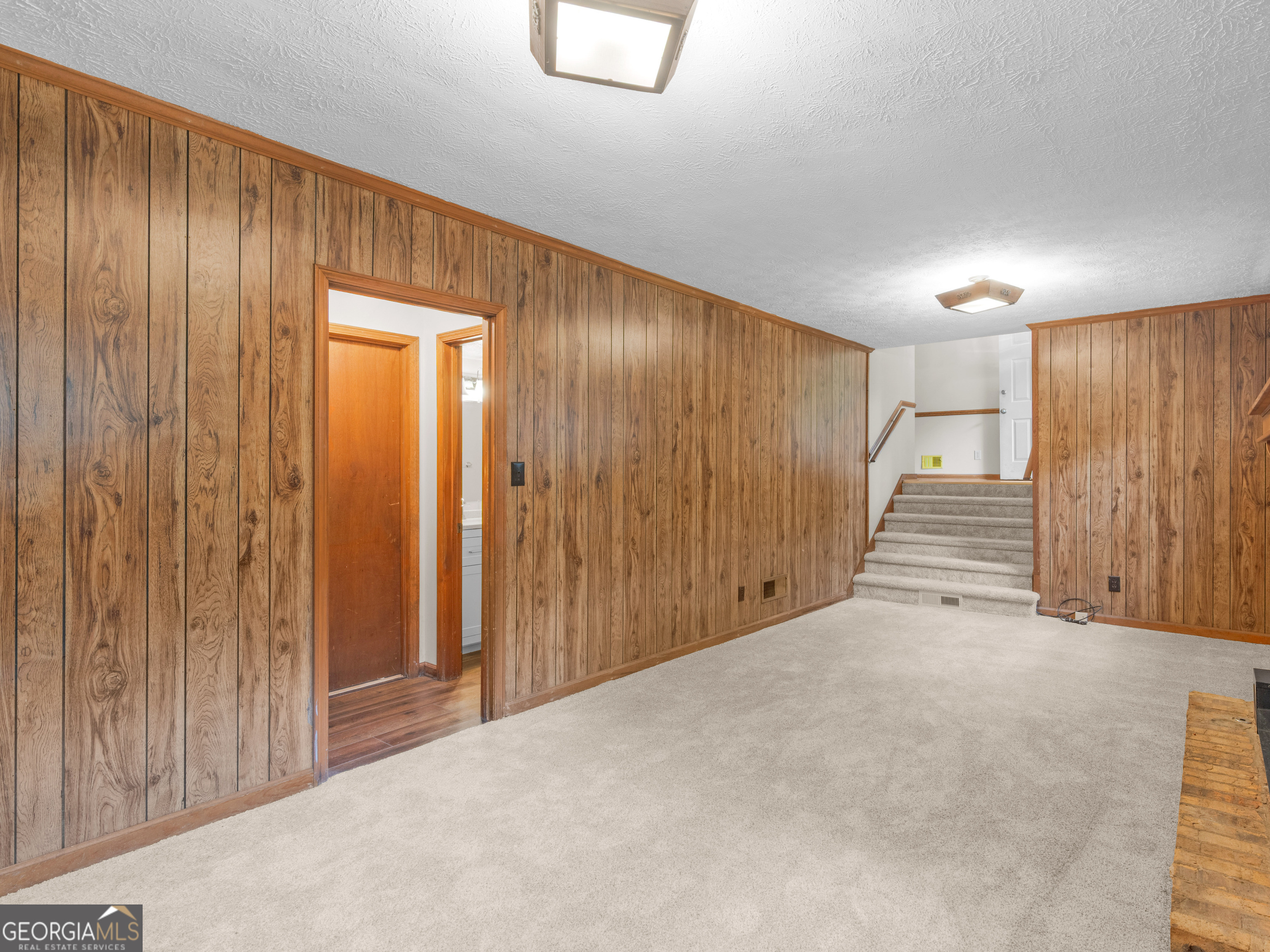 8294 Winston Way Jonesboro, GA 30236 - Photo 25 of 62 a view of an empty room with wooden walls