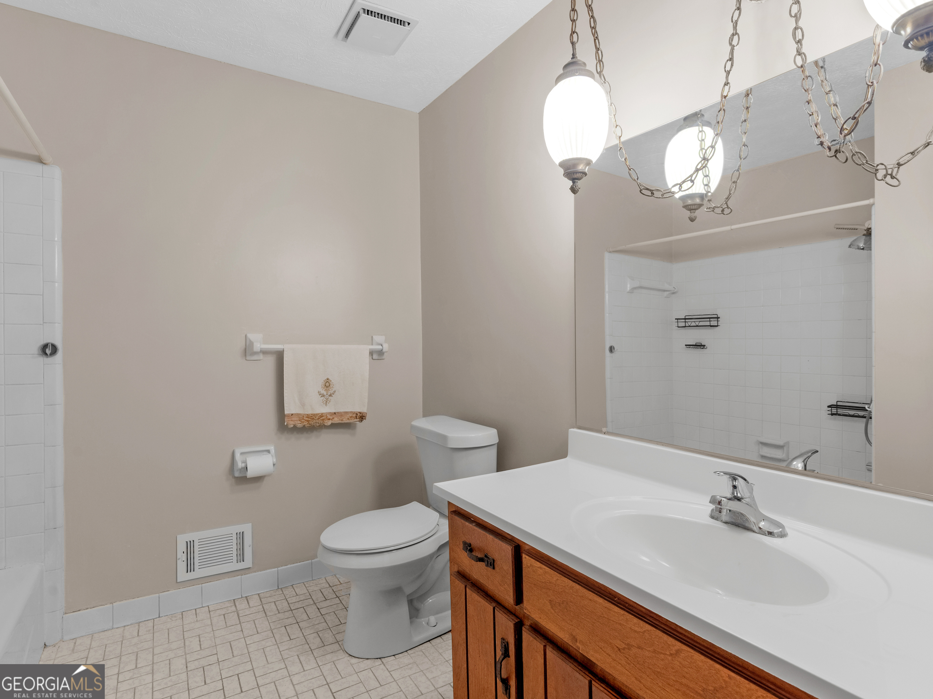 8294 Winston Way Jonesboro, GA 30236 - Photo 40 of 62 a bathroom with a sink a toilet and a mirror