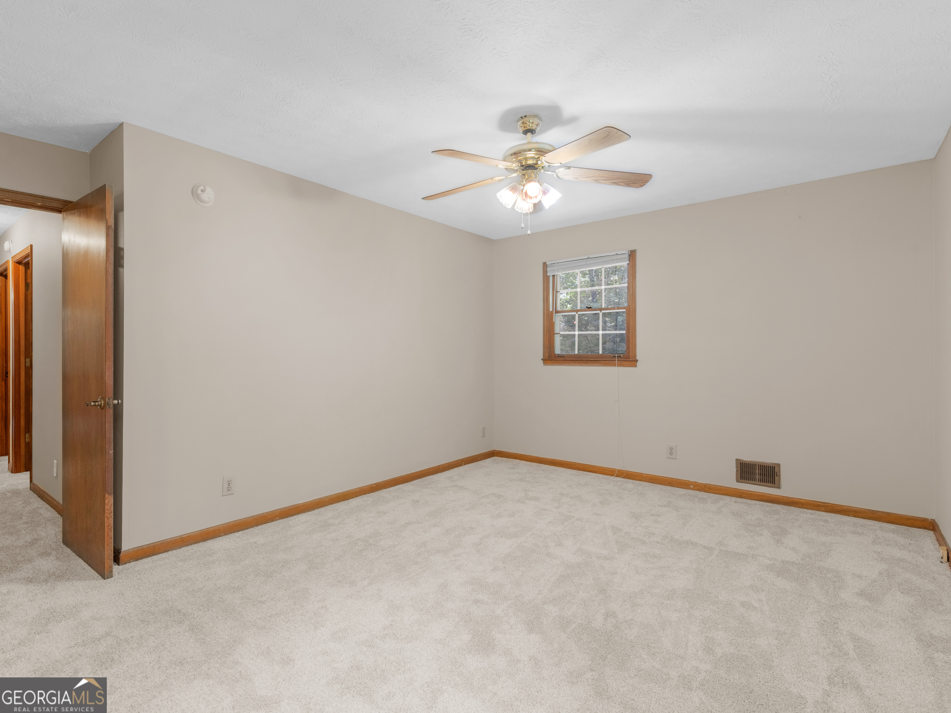 8294 Winston Way Jonesboro, GA 30236 - Photo 42 of 62 an empty room with windows and fan