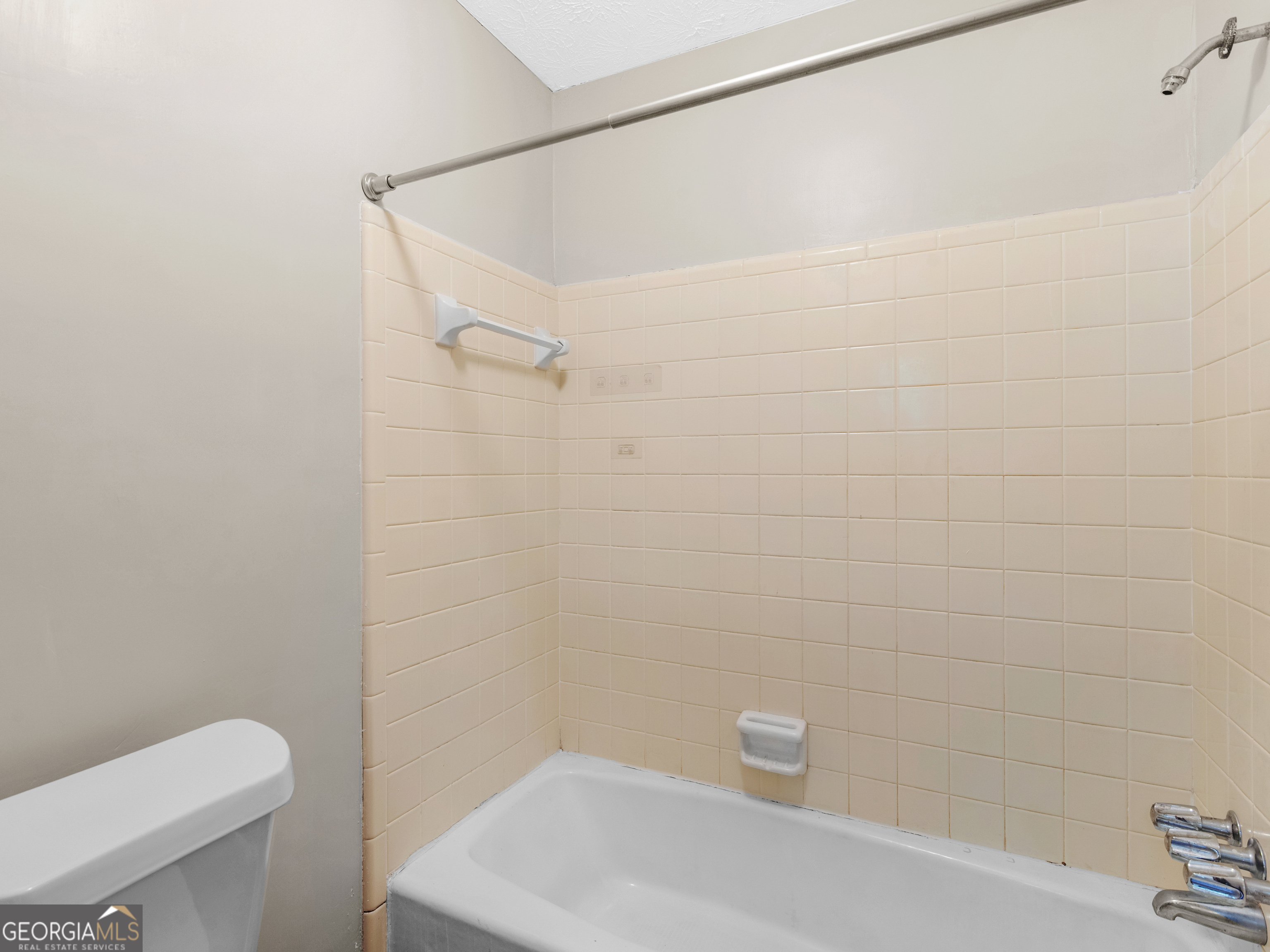 8294 Winston Way Jonesboro, GA 30236 - Photo 46 of 62 a bathroom with a shower and a toilet