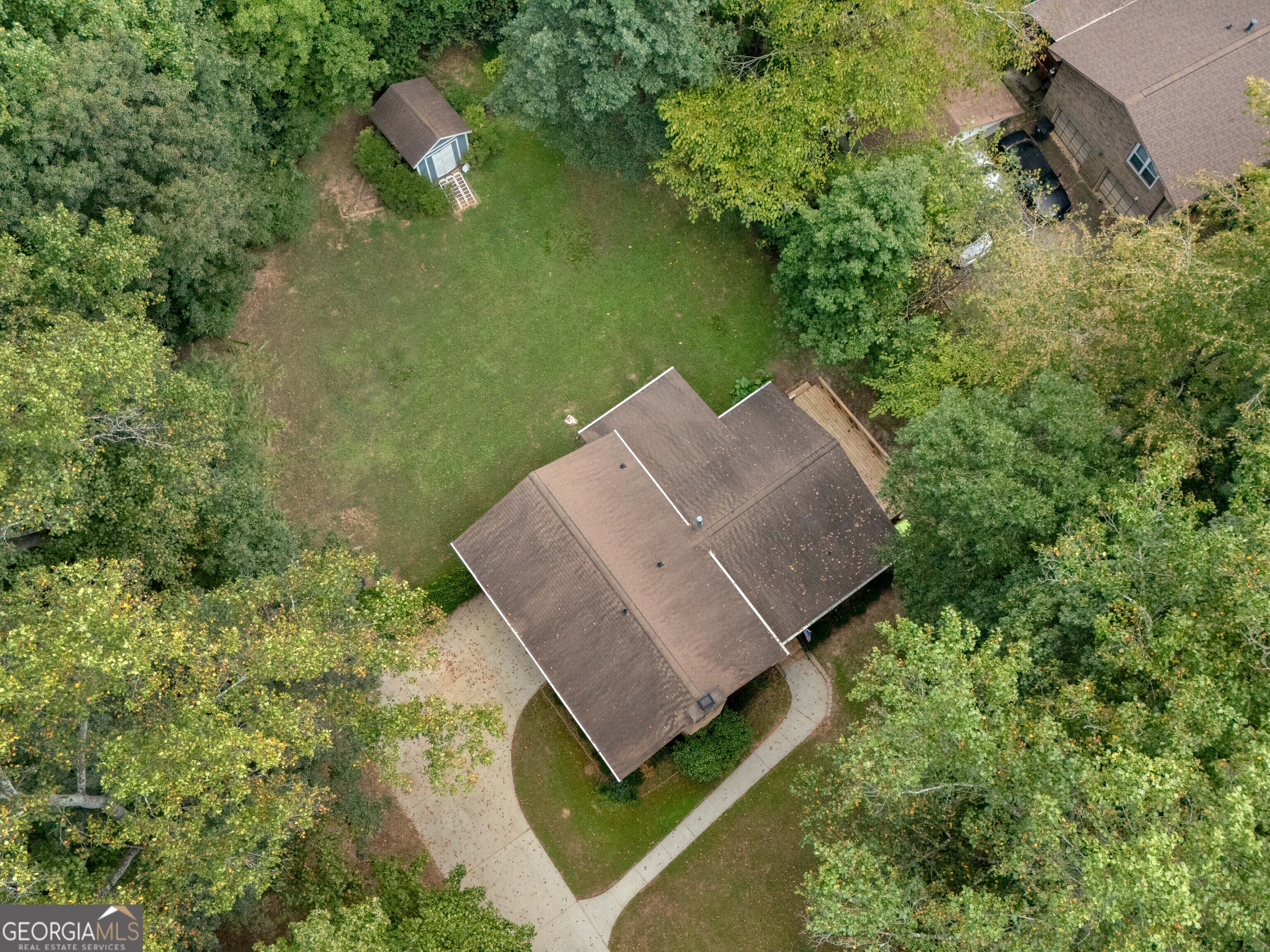 8294 Winston Way Jonesboro, GA 30236 - Photo 58 of 62 an aerial view of a house with a yard and lake view