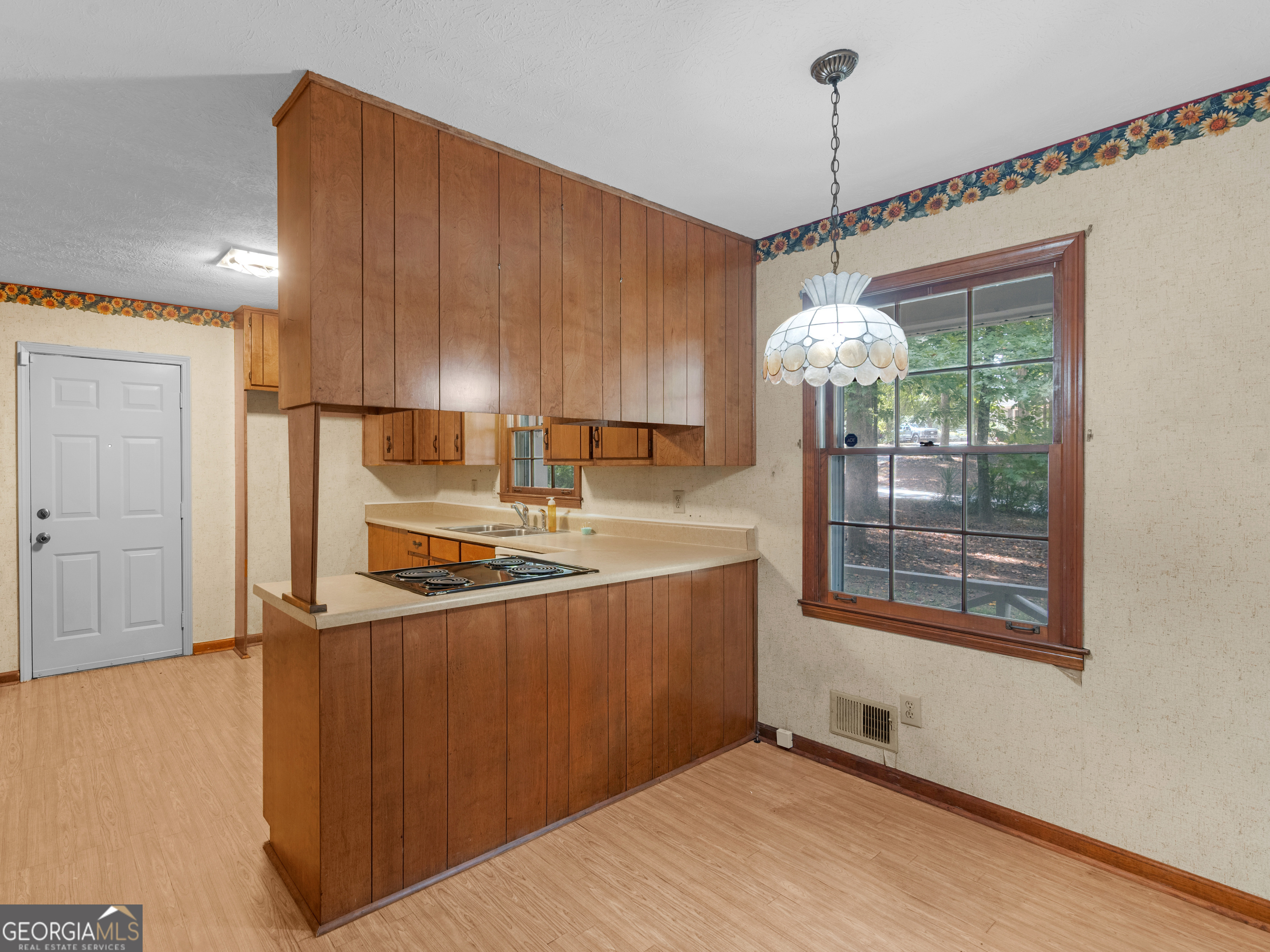 8294 Winston Way Jonesboro, GA 30236 - Photo 7 of 62 a kitchen with stainless steel appliances a stove a refrigerator and a wooden cabinets