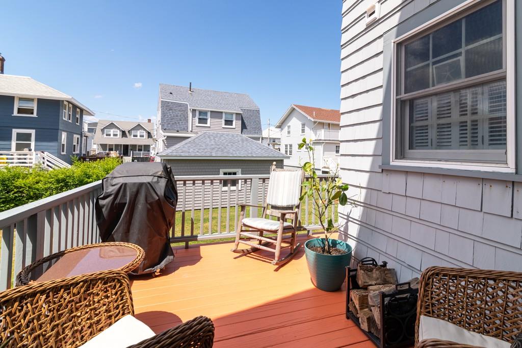 7 Mildred Street Hull, MA 02045 - Photo 12 of 26 a view of a porch with chairs and potted plants