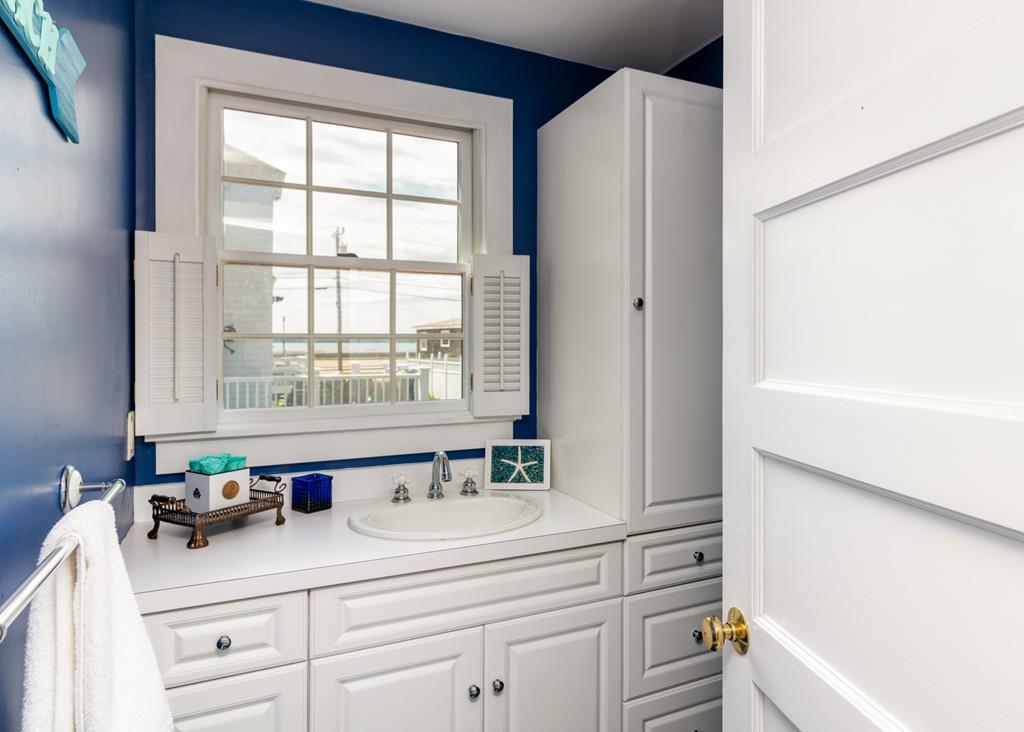 7 Mildred Street Hull, MA 02045 - Photo 15 of 26 a bathroom with a sink and a bathtub