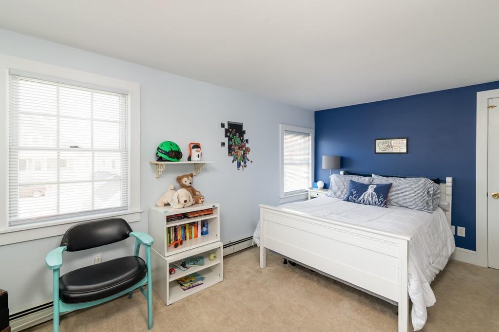7 Mildred Street Hull, MA 02045 - Photo 16 of 26 a bedroom with a bed and a window