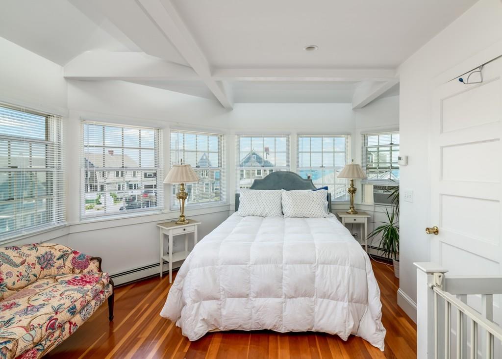 7 Mildred Street Hull, MA 02045 - Photo 20 of 26 a bedroom with a large bed and a window