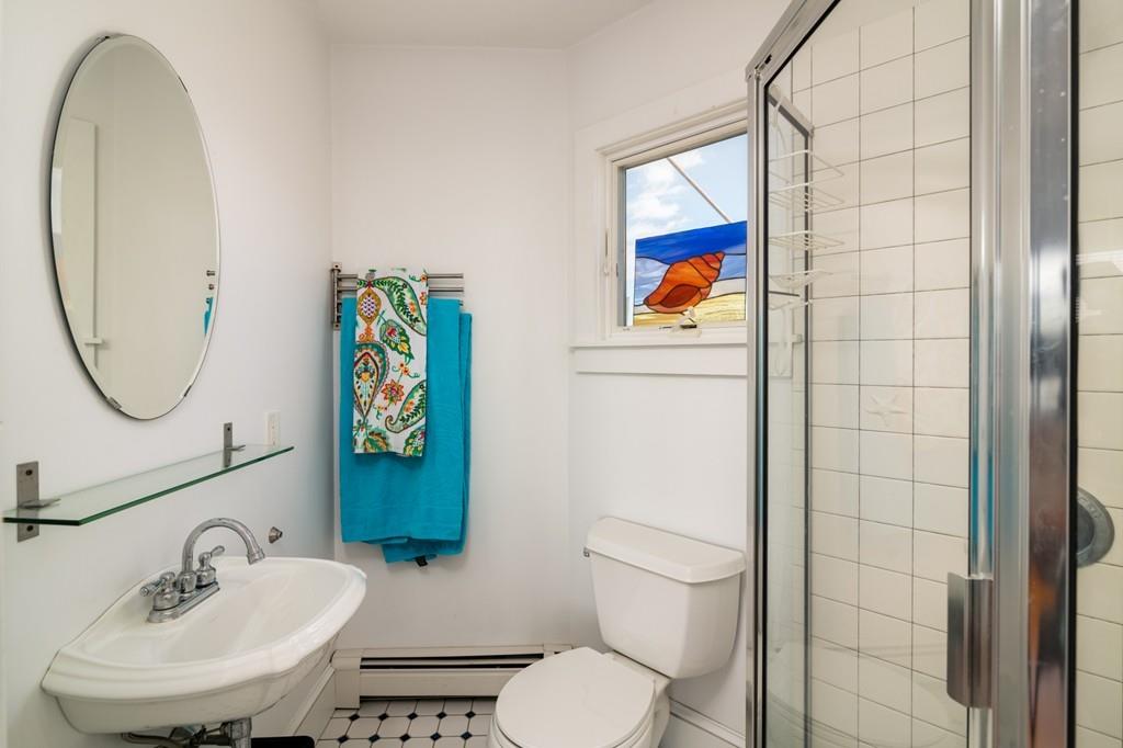 7 Mildred Street Hull, MA 02045 - Photo 22 of 26 a bathroom with a toilet a sink and mirror