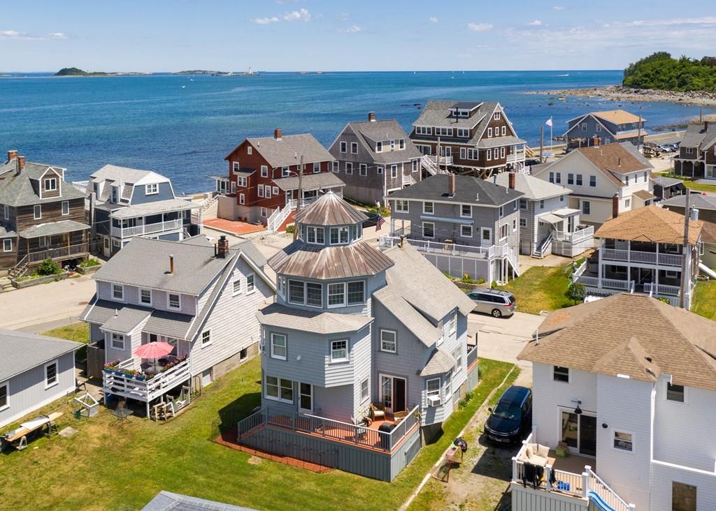 7 Mildred Street Hull, MA 02045 - Photo 26 of 26 a aerial view of a house with swimming pool and large trees