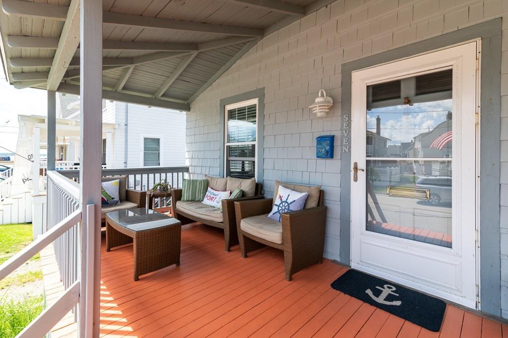 7 Mildred Street Hull, MA 02045 - Photo 5 of 26 a living room with furniture and a floor to ceiling window