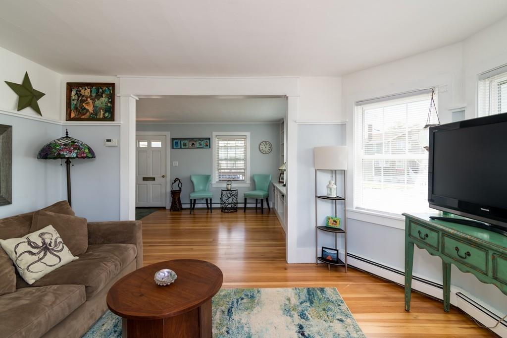7 Mildred Street Hull, MA 02045 - Photo 10 of 26 a living room with furniture and a flat screen tv