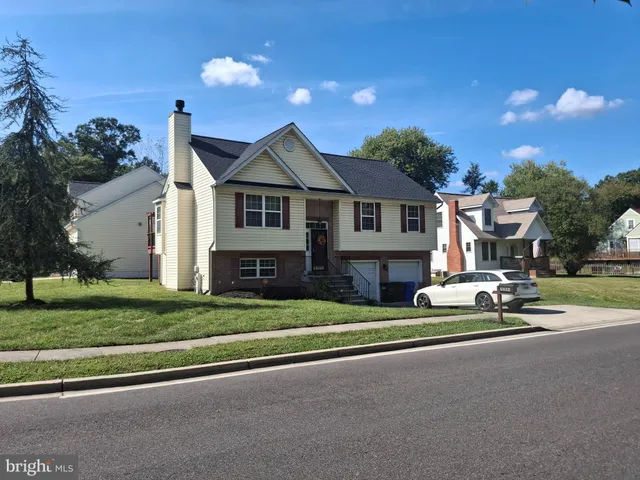 a front view of a house with a garden and porch