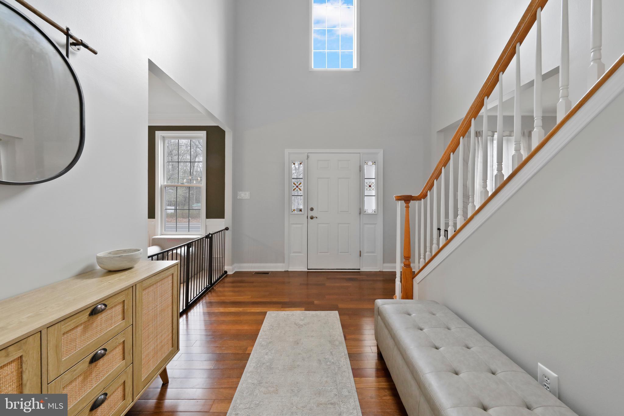 542 Hartford Road Mount Laurel, NJ 08054 - Photo 7 of 59 a view of a hallway with wooden floor and entryway
