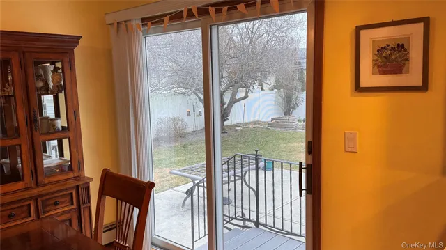 a view of a balcony with furniture and wooden floor