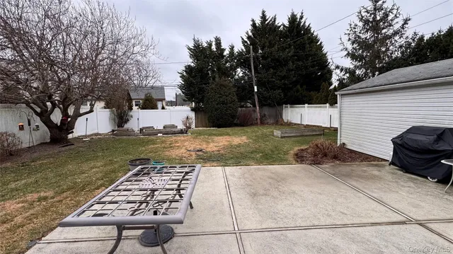 a view of a patio with a yard