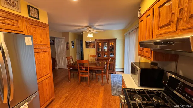 a dining room with furniture and wooden floor