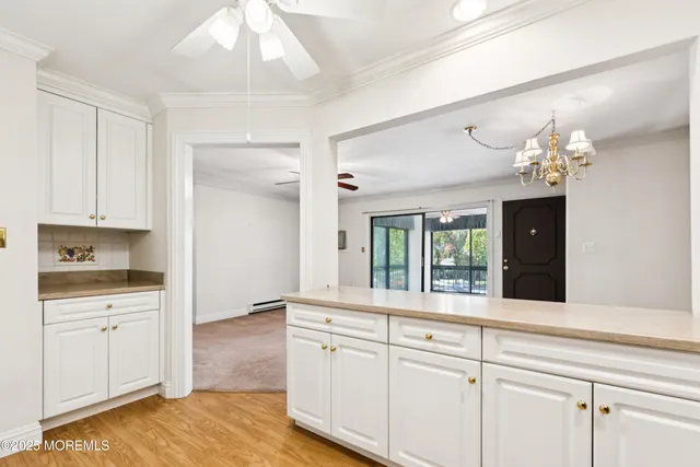 a spacious bathroom with a granite countertop sink a mirror and a shower