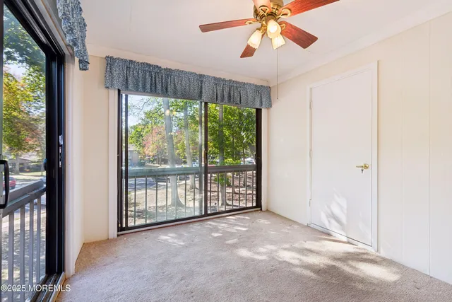 a view of a room with a large window