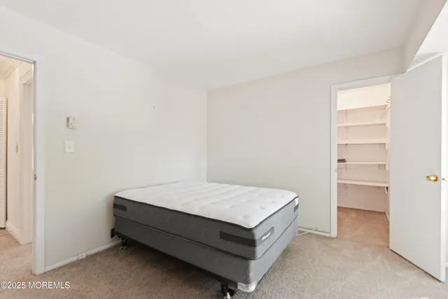 a room with a bed and a window